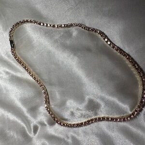 Gold necklace with pink gems